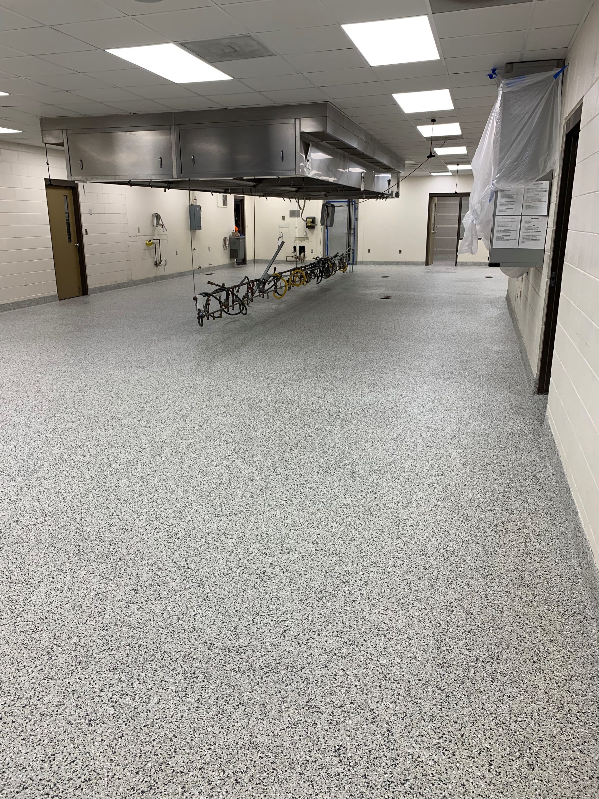 Manufacturing Facility Epoxy Floor Coating with Decorative Flake and Quartz Finishes